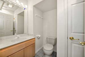 bathroom featuring vanity and light tile patterned flooring