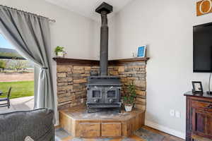 Detailed view of baseboards and a wood stove