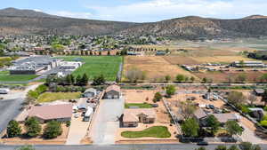 Aerial perspective of suburban area featuring a mountain backdrop