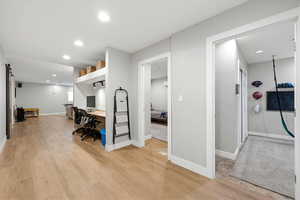 Home office with recessed lighting and light wood finished floors