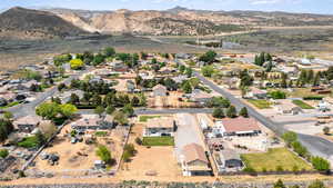 View of property location with a mountainous background and nearby suburban area