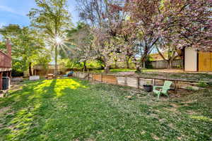 Fenced backyard with a playground