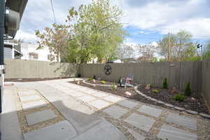 Fenced backyard featuring a patio area