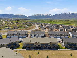 Aerial view of residential area featuring a mountainous background