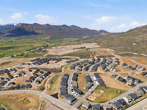 Aerial perspective of suburban area featuring a mountain backdrop