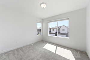 Unfurnished room with carpet flooring