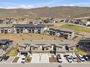 Aerial view of residential area featuring a mountainous background