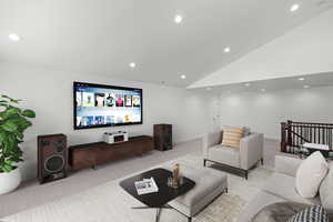 Living room featuring light colored carpet, recessed lighting, and a high ceiling