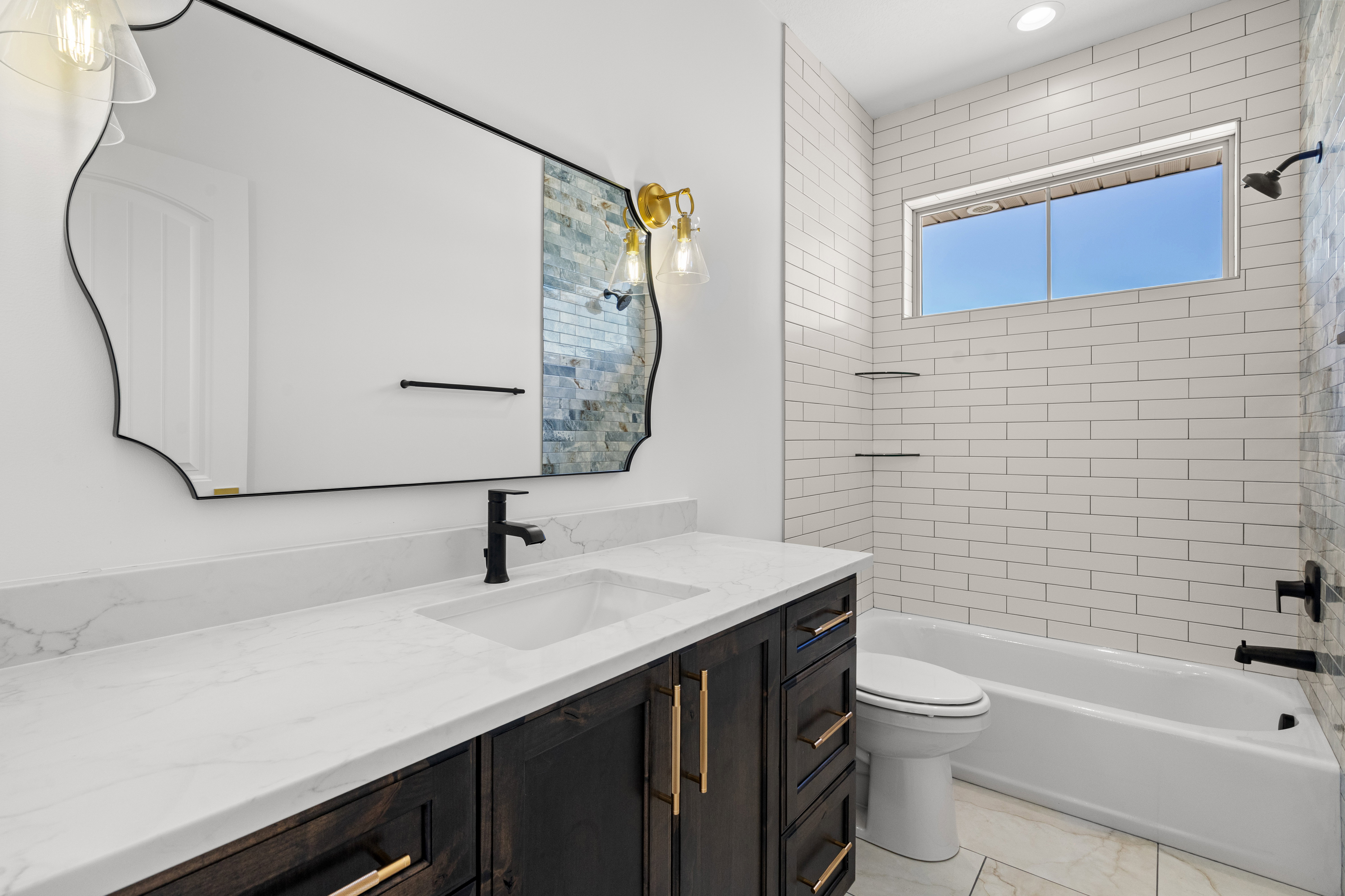 Bathroom with vanity and shower / bath combination