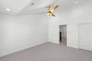 Unfurnished bedroom with recessed lighting, carpet flooring, a ceiling fan, and vaulted ceiling
