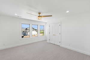 Unfurnished bedroom with carpet, ceiling fan, a closet, and recessed lighting