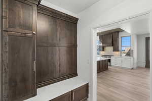Mudroom featuring light wood-style floors
