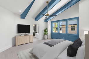 Bedroom with ceiling fan, carpet, vaulted ceiling with beams, and ensuite bath