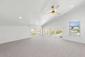 Unfurnished living room with carpet, recessed lighting, a ceiling fan, and vaulted ceiling