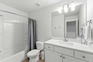 Full bathroom with vanity and shower / bathtub combination with curtain