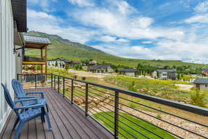 Balcony with a residential view and a mountain view