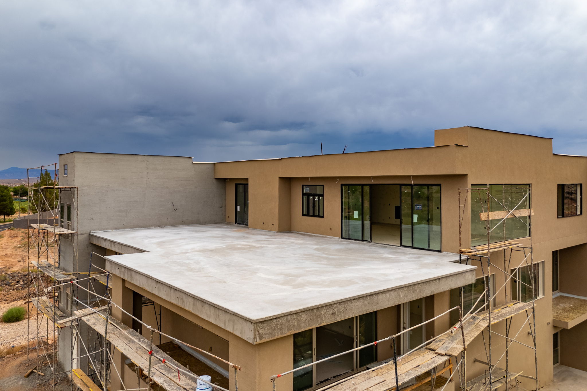 Back of house featuring stucco siding