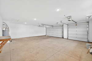 864 Sq Feet Garage with strapped water heater and recessed lighting