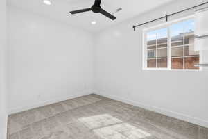 featuring light colored carpet, recessed lighting, and a ceiling fan