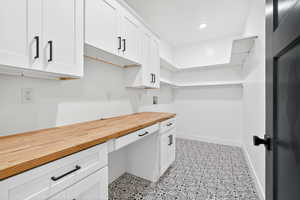 Laundry room with washer hookup and cabinet space