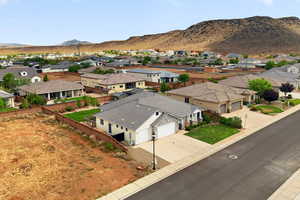 Aerial view of residential area featuring a mountain backdrop