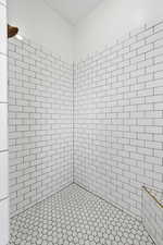 Full bathroom with a tile shower