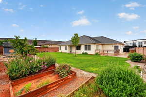 Back of property featuring a fenced backyard, a patio area, and a deck