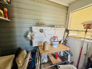 Mudroom featuring wooden walls