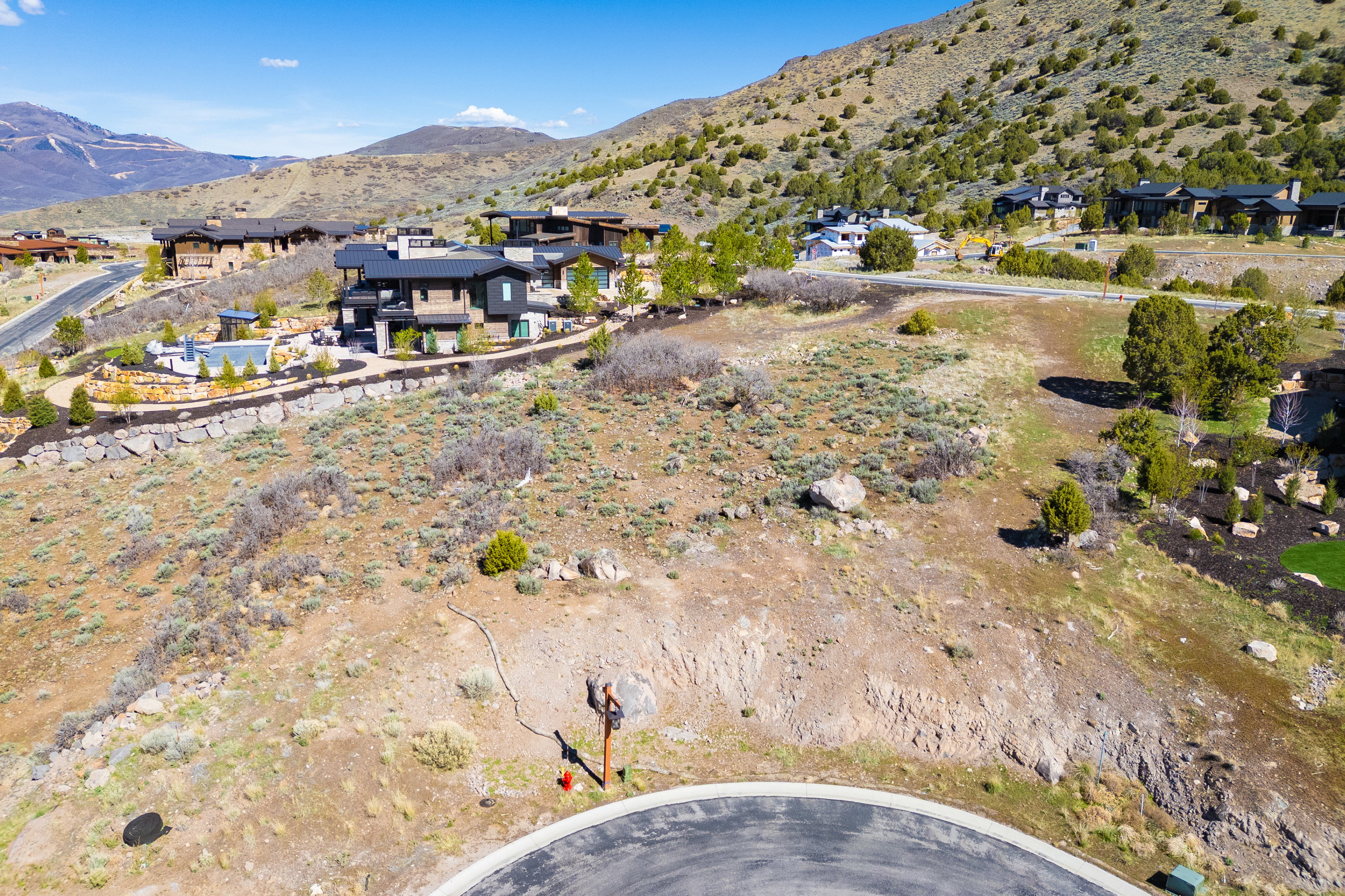Aerial perspective of suburban area featuring a mountainous background