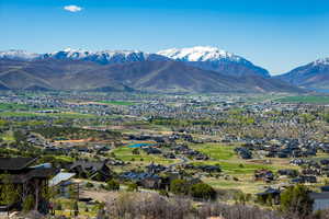 View of mountain backdrop with nearby suburban area and a local golf course