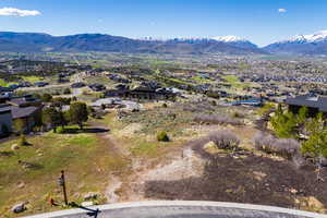 View of mountain backdrop featuring nearby suburban area