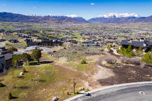 View of mountain backdrop featuring nearby suburban area