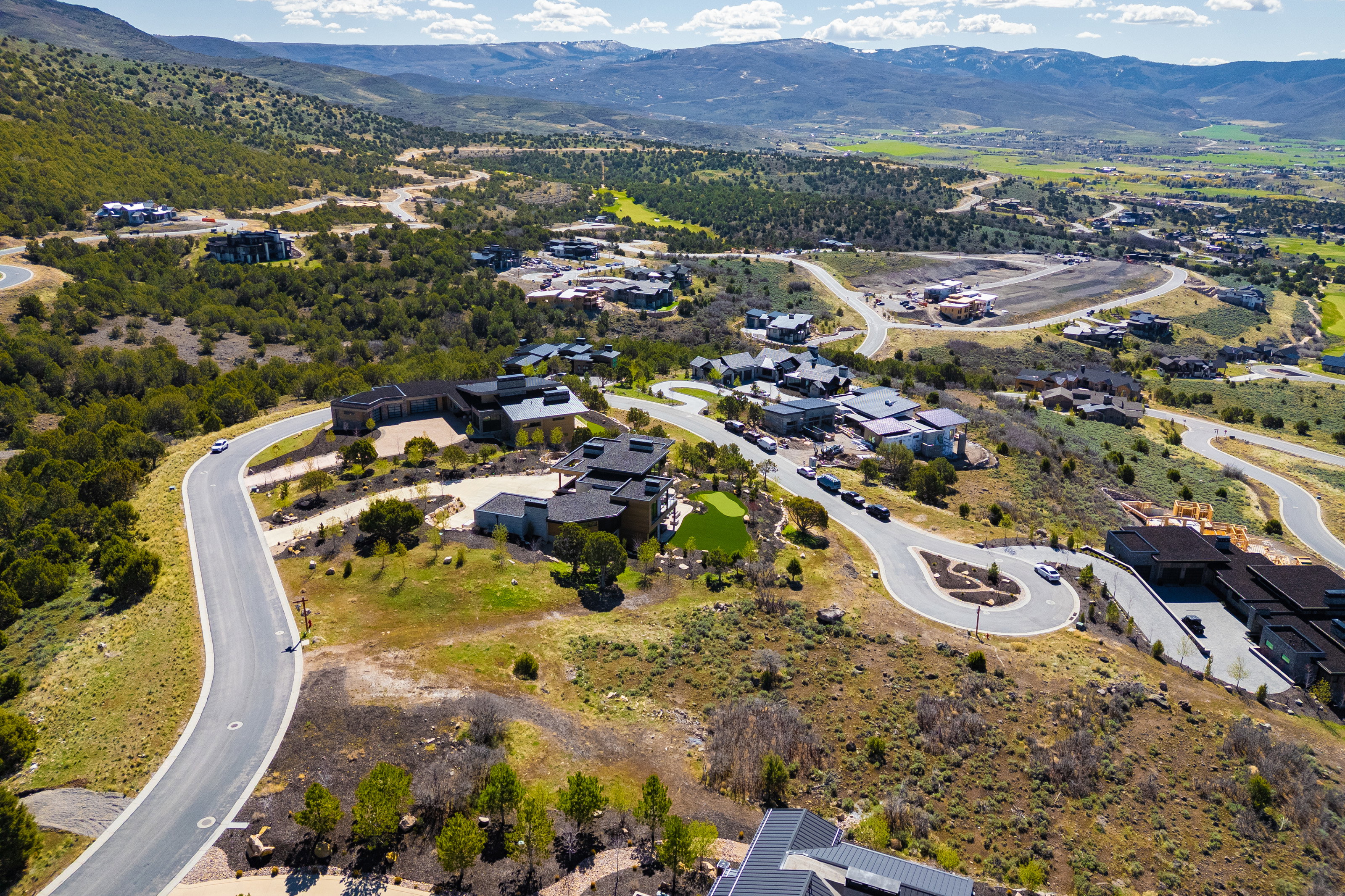 Aerial overview of property's location featuring a mountainous background