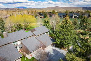 Aerial perspective of suburban area with a mountain backdrop