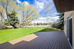 Deck featuring a lawn