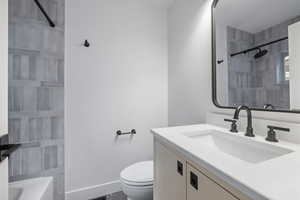 Full bath featuring vanity and toilet