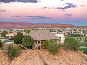 Aerial view of residential area featuring a mountainous background