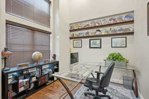Office area with wood finished floors and baseboards