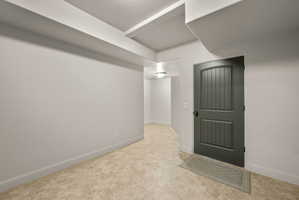 Empty room featuring baseboards
