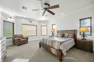 Bedroom featuring light colored carpet, a ceiling fan, and recessed lighting