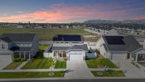 Aerial perspective of suburban area with a mountain backdrop