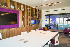 Dining room featuring built in shelves