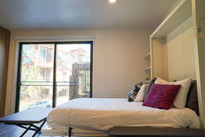 Bedroom featuring access to exterior and recessed lighting