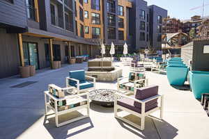 View of patio / terrace with an outdoor living space with a fire pit