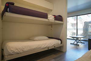 Bedroom with dark wood-type flooring