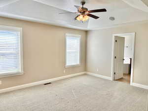 Unfurnished room featuring a textured ceiling, ceiling fan, and light carpet