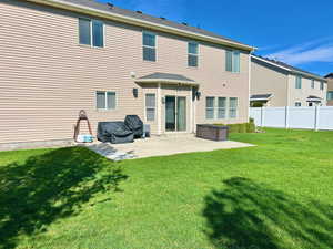 Back of property with a patio