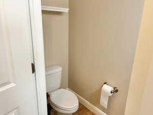 Bathroom with baseboards and toilet
