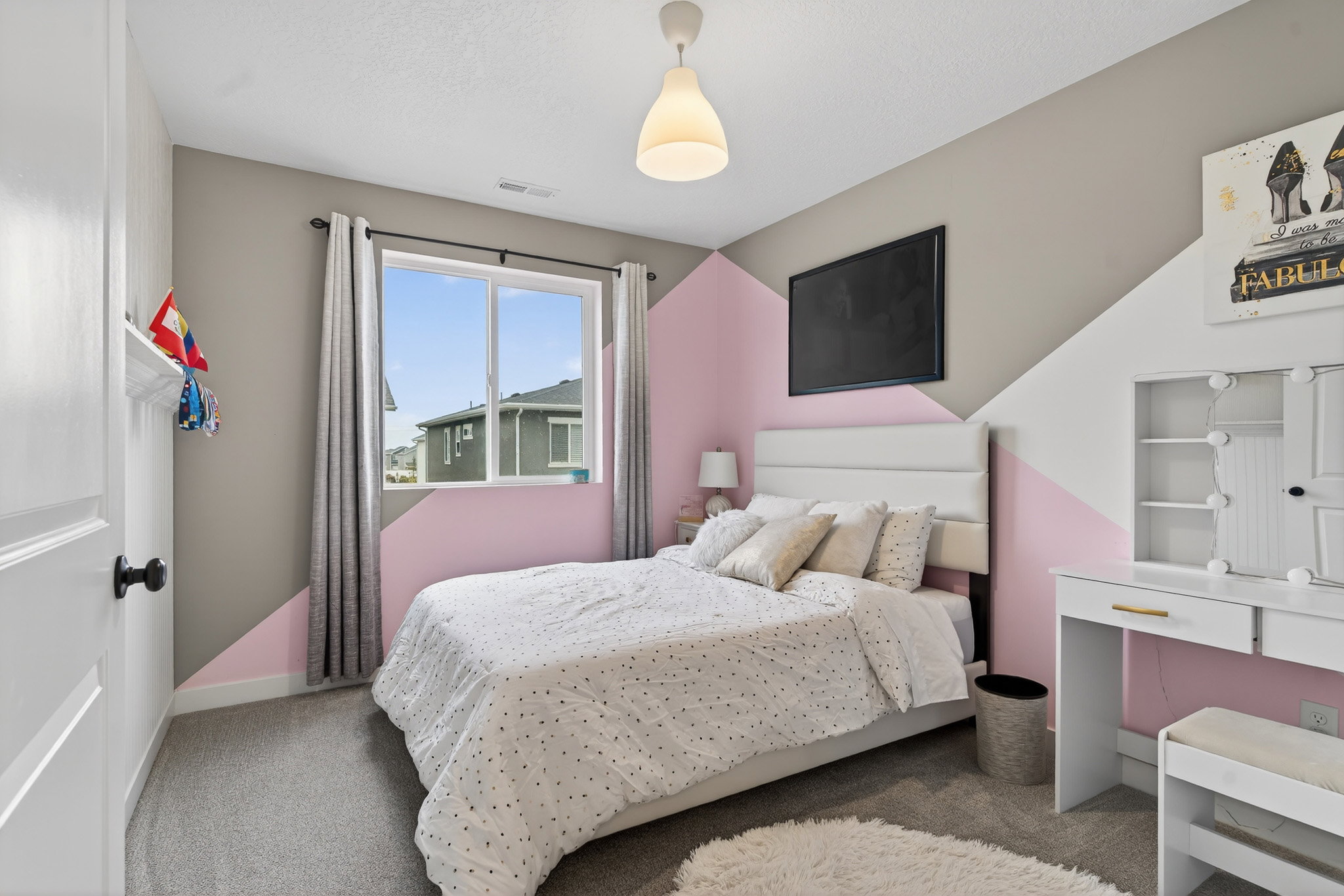 Carpeted bedroom featuring baseboards