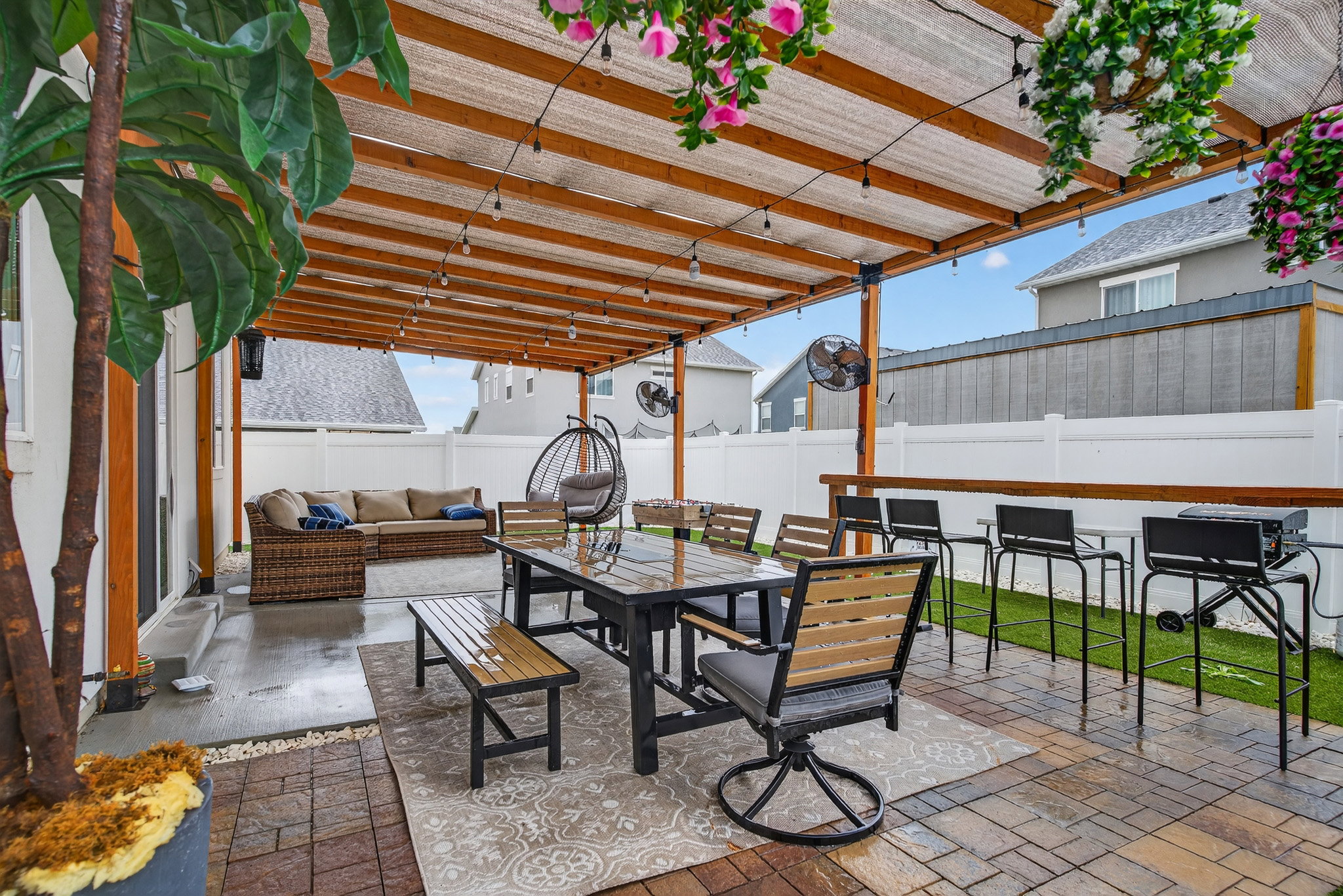 Fenced backyard featuring a patio area and an outdoor living / dining area